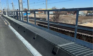 Corrugated steel curb inlet collecting roadway stormwater runoff