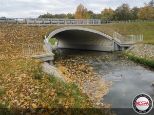 Roadway crossing restored using a structural plate bridge after mining damage.