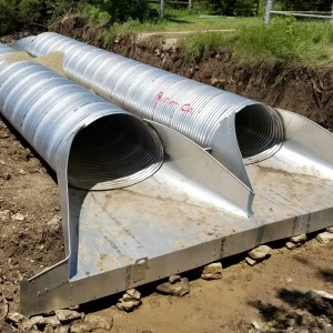 Corrugated steel pipe end treatment installed at culvert outlet