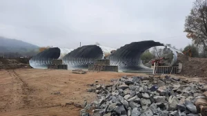 WhatsApp-Image-2024-02-28-at-13.38.41_resized Steel buried bridge components staged before installation at the Balan Bridge project in Romania.