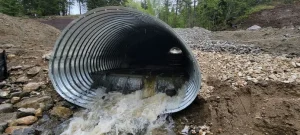 Corrugated steel pipe conveying stormwater through a culvert