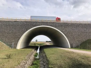 Corrugated steel bridge supporting fish passage and natural stream habitat