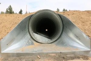 fabricated steel pipe ends on stream crossing project protecting local fish populations while improving roadway safety.
