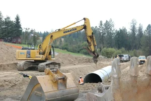 Corrugated steel pipe installation supporting an aquatic organism passage structure.