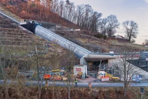 Galvanized corrugated steel structural plate enclosure protecting the passenger incline lift during construction at Leuchtenburg Castle.