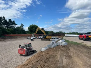 42-inch corrugated steel pipe staged for the Oak-Land Middle School underground stormwater retention system.