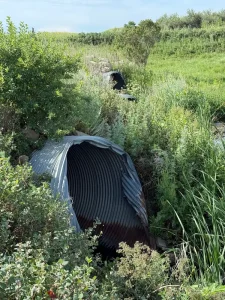 TrueNorth Steel_Oliver County ND Pipe Replacement_CSP(6)_resized Failed culvert at the Oliver County road site before replacement with corrugated steel pipe.